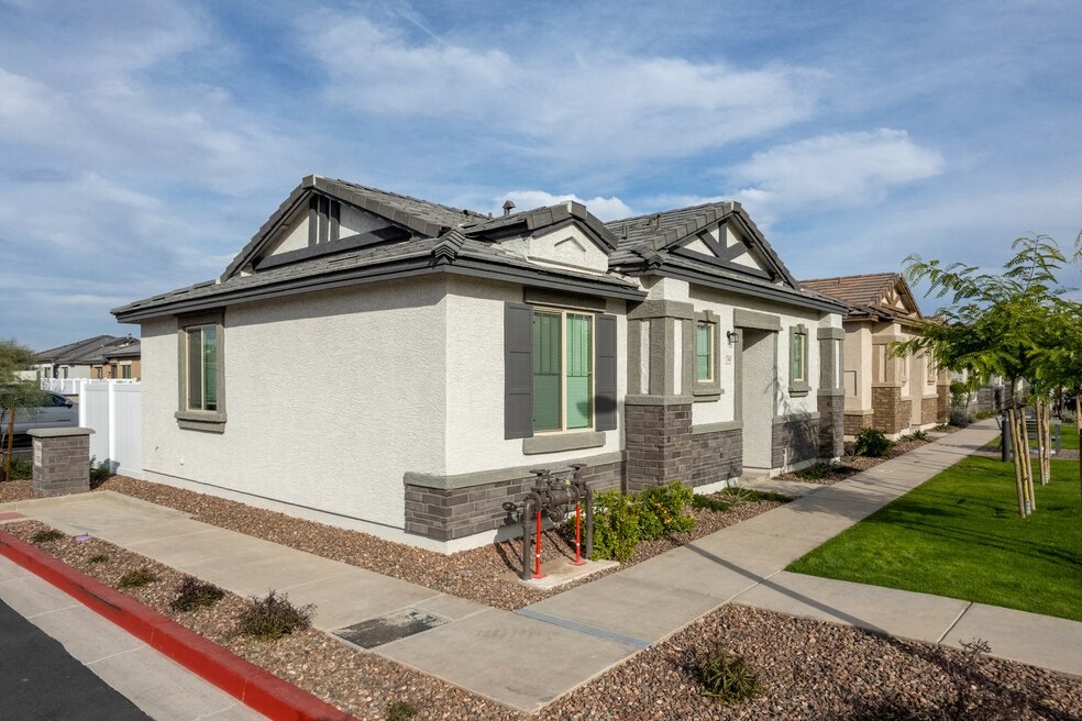 a row of houses with a bike parked in front of a sidewalk