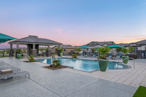 sunset view of poolhouse