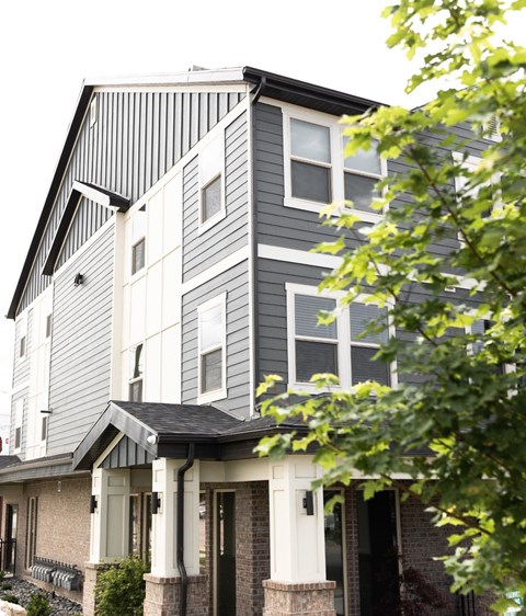 A modern house with a grey and white exterior.