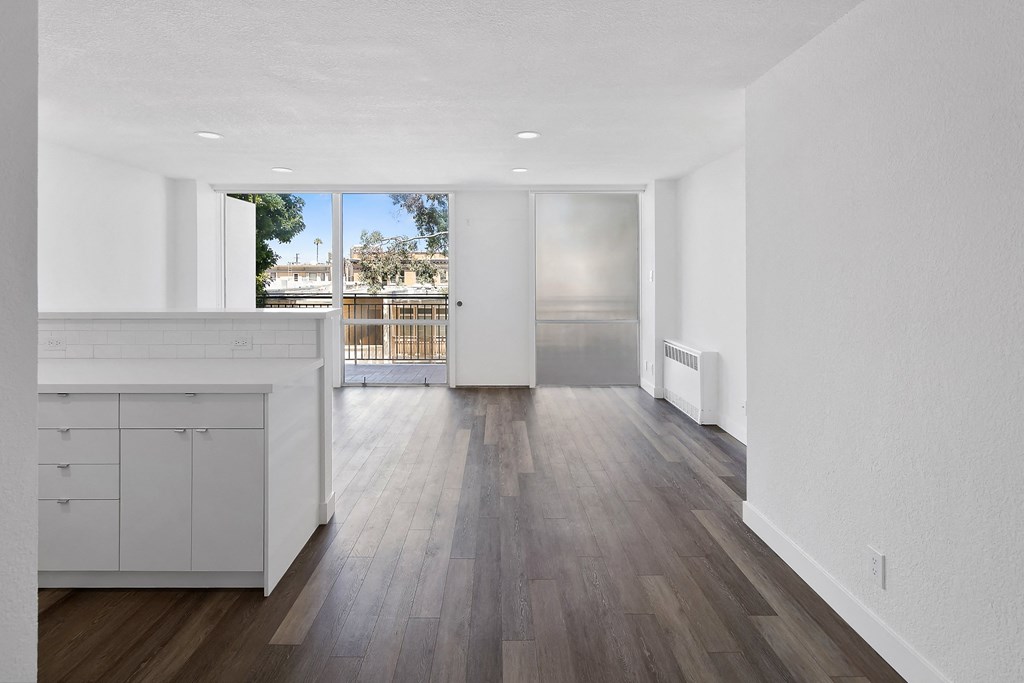 a kitchen and living room in a 555 waverly unit