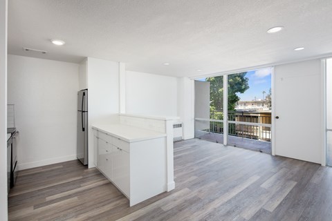 a kitchen and living room in a 555 waverly unit