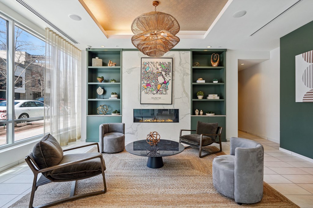 a living room with a fireplace and a large window