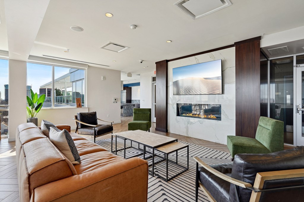 a living room filled with furniture and a large window