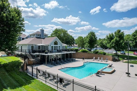 A large house with a pool in the backyard.