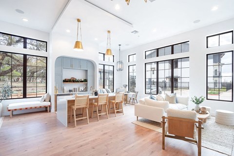 A modern living room with a fireplace and a dining table.