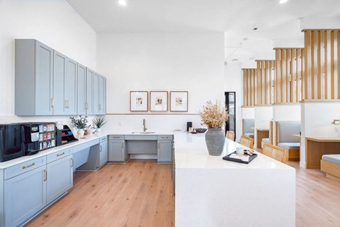 A modern kitchen with wooden cabinets and a white island.