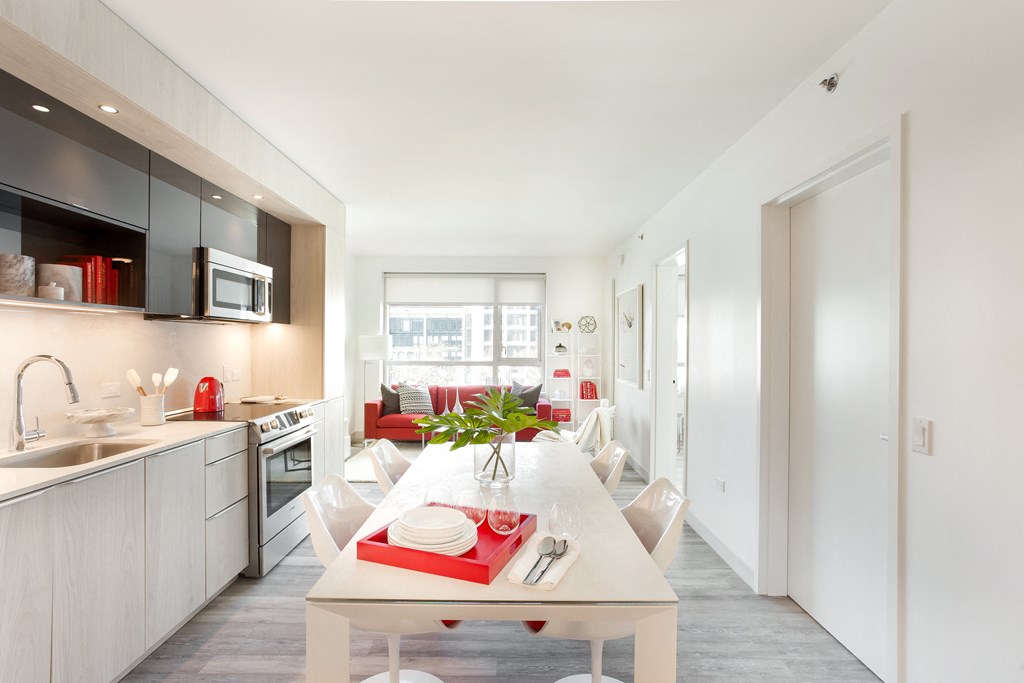 a kitchen and dining area in a 555 waverly unit