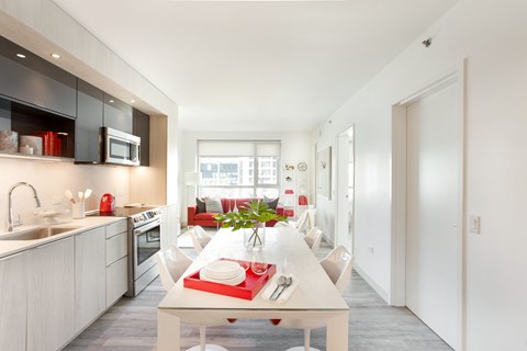 a kitchen and dining area in a 555 waverly unit