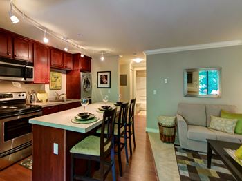 Kitchen & Living Room at Whispering Brook Apartments, Des Moines, WA,98198