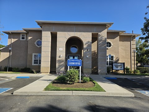 A building with a sign that says "Leasing Office".
