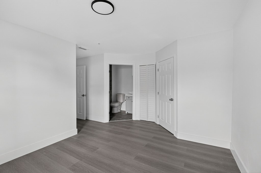 A room with a grey floor and white walls.