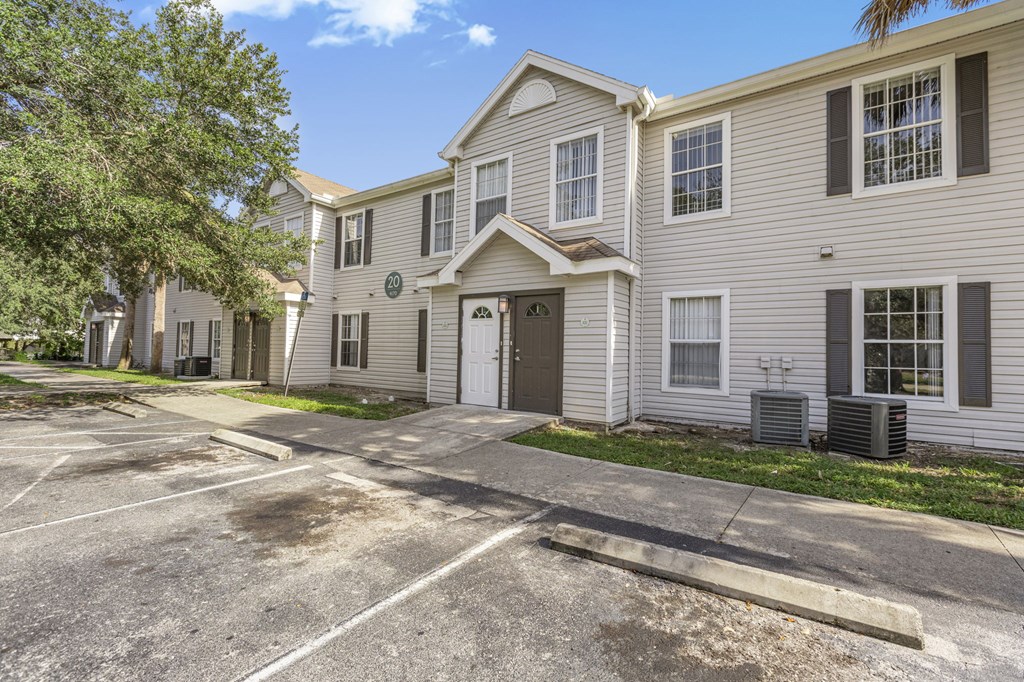 A sunny day at the apartment complex with a clear blue sky.