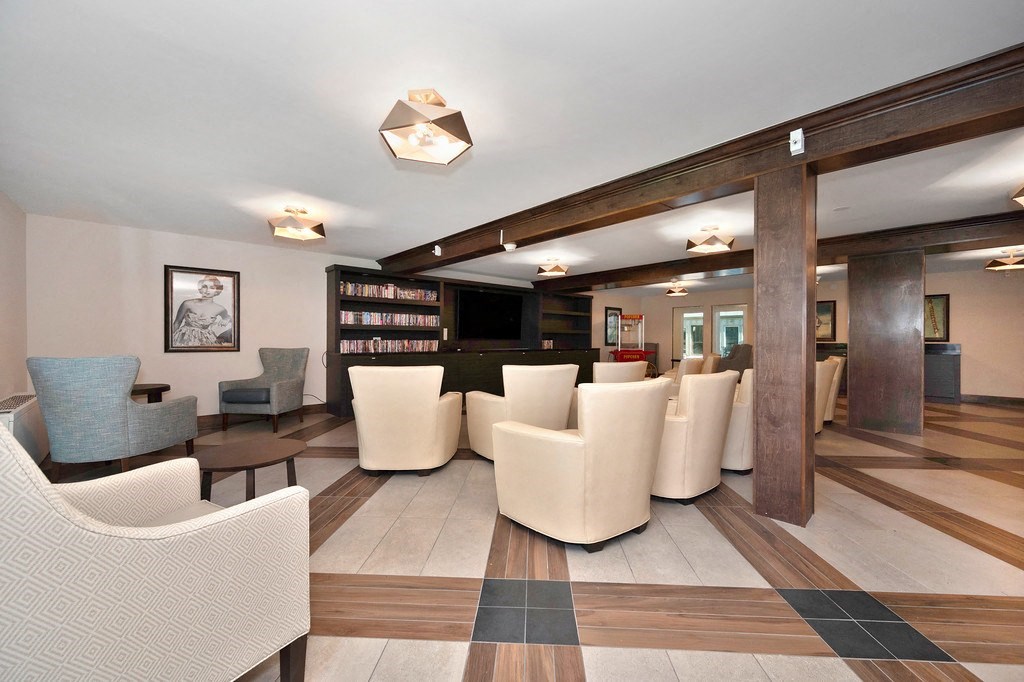 a common area with chairs and a table  at The Crest at Citrus Heights, California