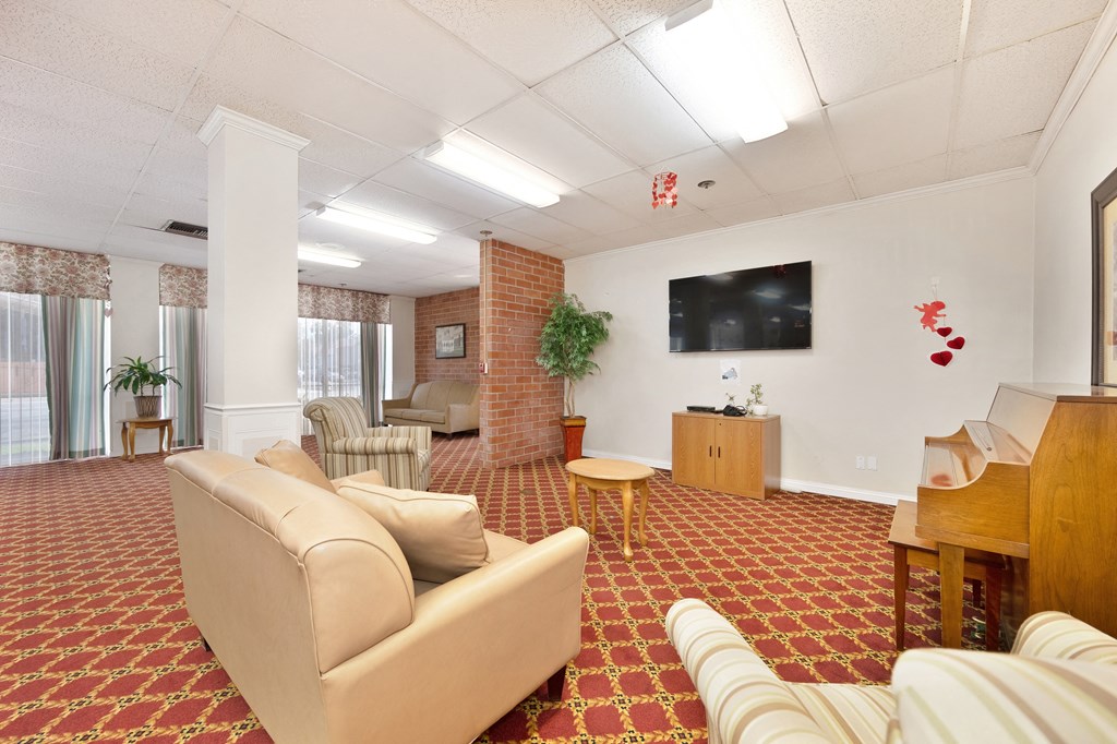 a living room filled with furniture and a television
