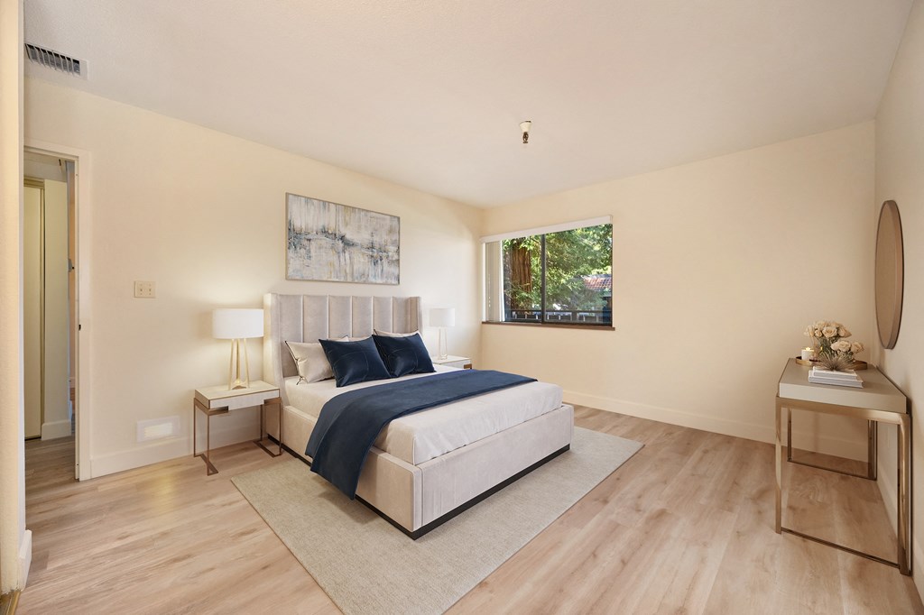 a bedroom with a large bed and a window