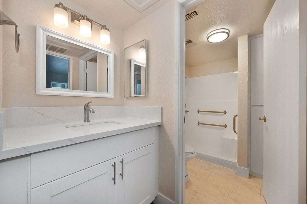 a bathroom with a sink and a mirror