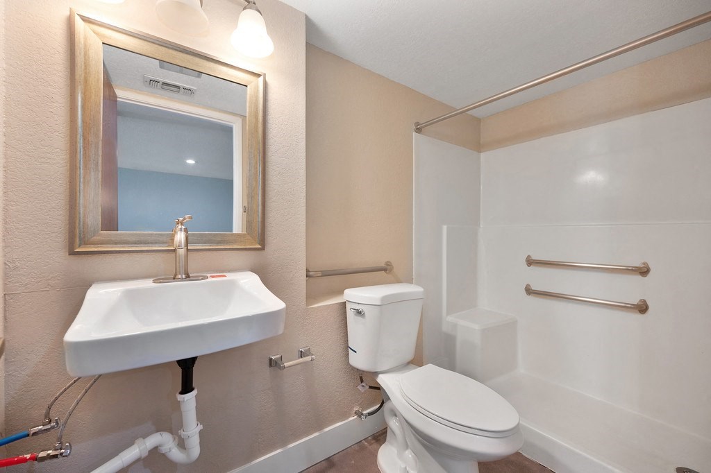 a bathroom with a sink toilet and bathtub