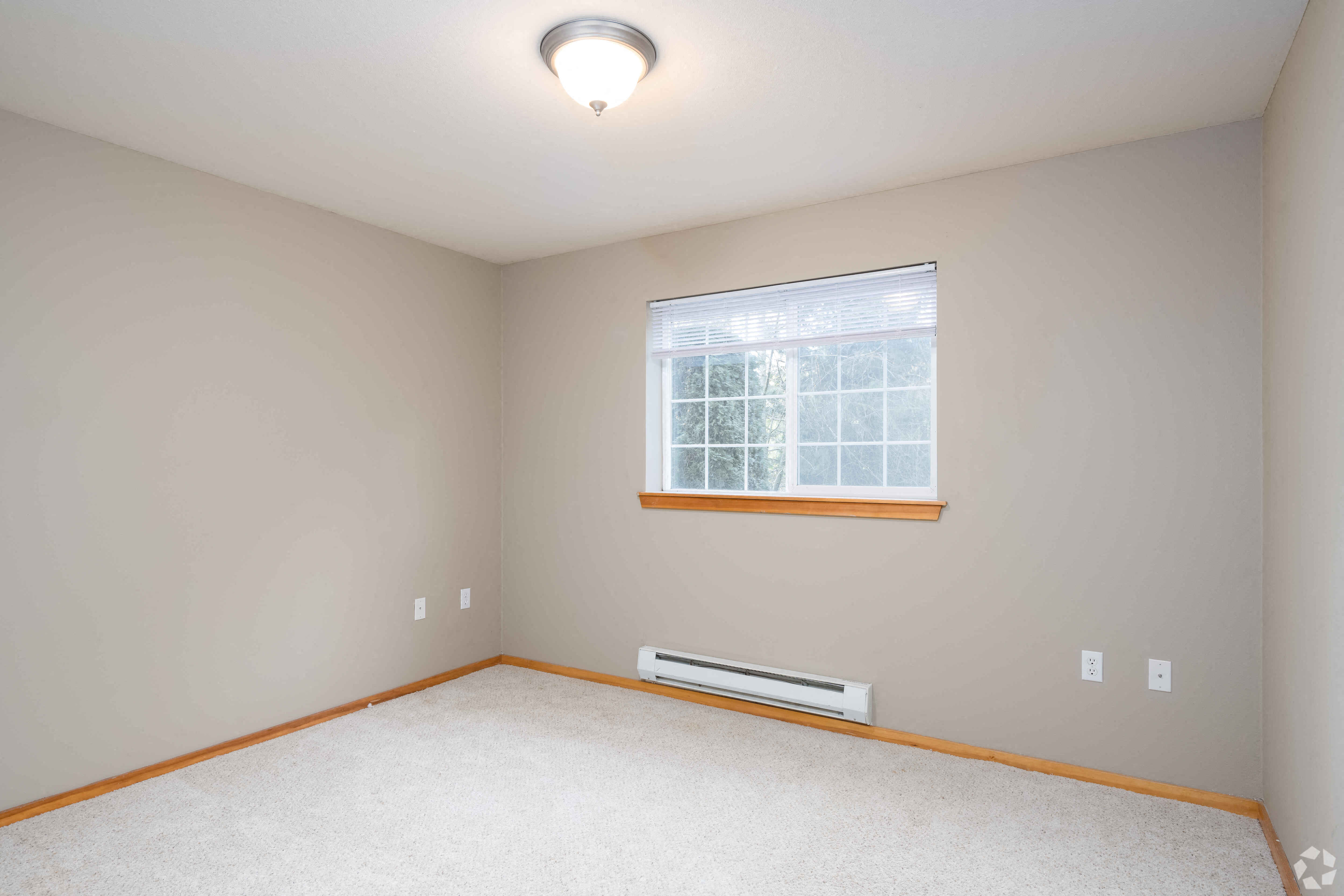 Bedroom with window at Springbrook Reserve Apartments, Washington