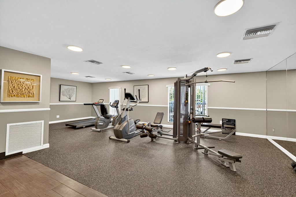 A spacious gym with a variety of exercise equipment.