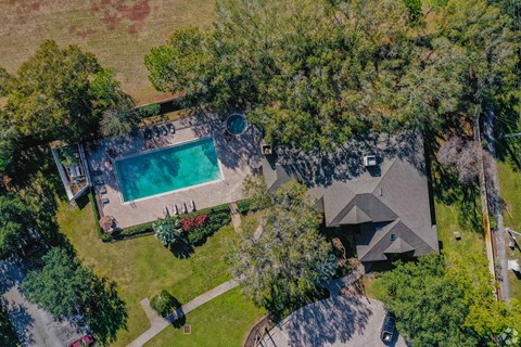 a birds eye view of a house with a swimming pool