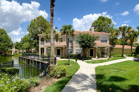 a large house with a dock on a body of water