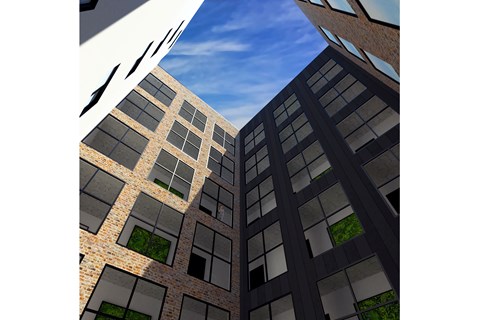 A tall building with a lot of windows and a sky background.