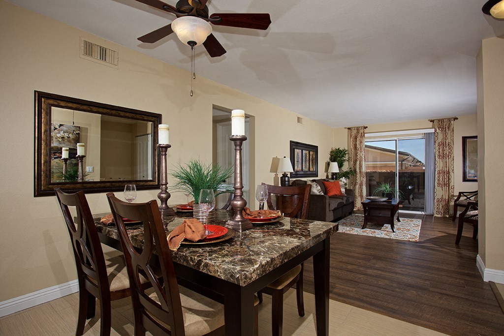 a dining room with a table and chairs
