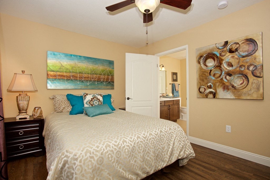 a spiral staircase with a mural on the wall