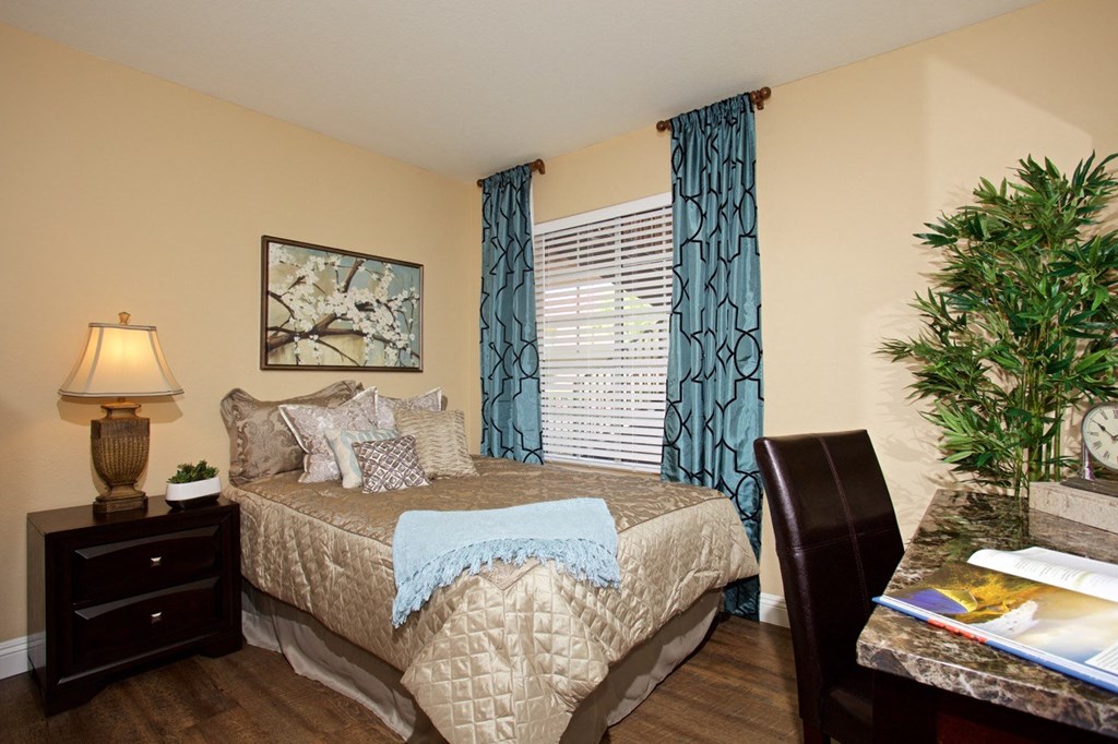 a bedroom with a bed and a christmas tree