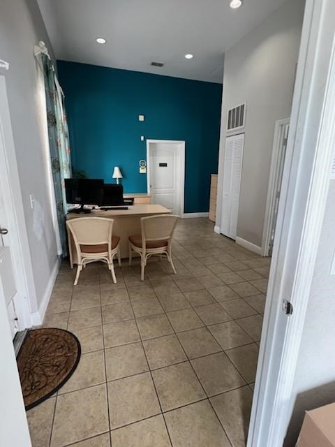 A room with a blue wall and a white door.