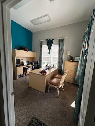 A room with a desk and a chair.