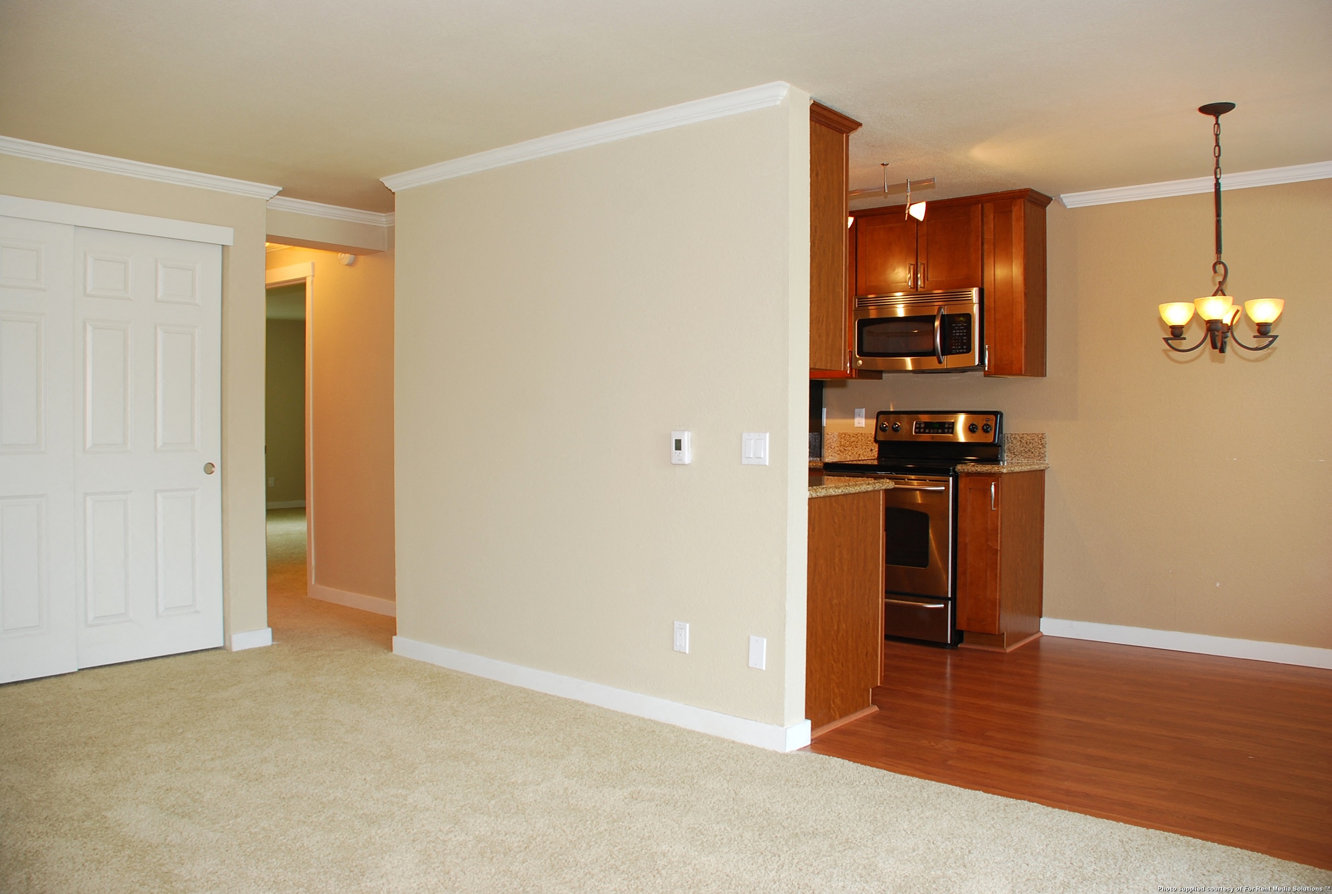 Living Room with Kitchen view at Landing at Angle Lake Apartments, SeaTac, Washington