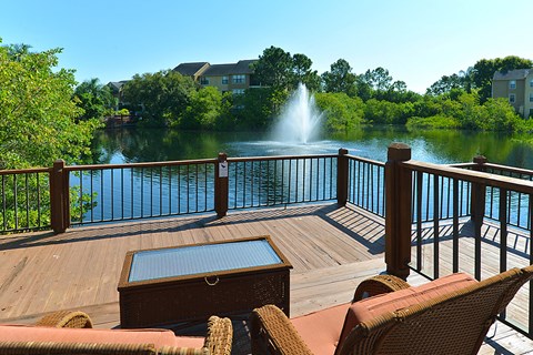 a large dock with a fountain on the water