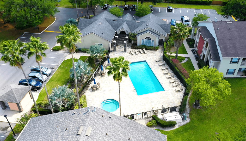 A bird's eye view of a house with a pool.