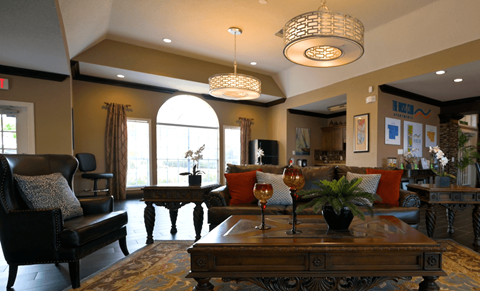 A living room with a brown sofa and a wooden coffee table.