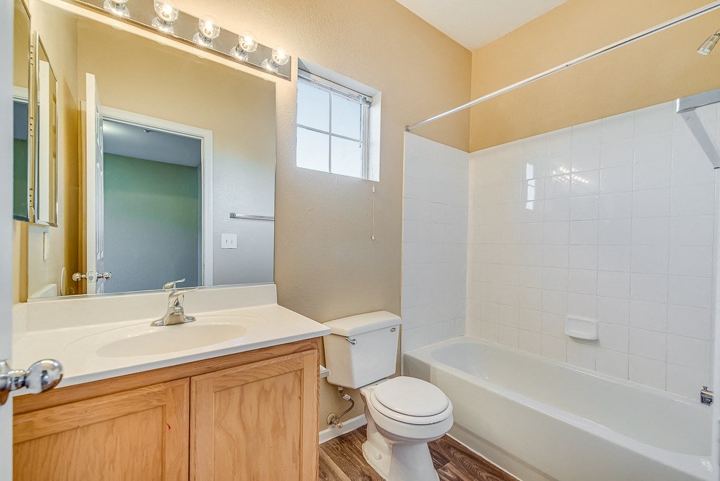 a bathroom with a sink toilet and a tub