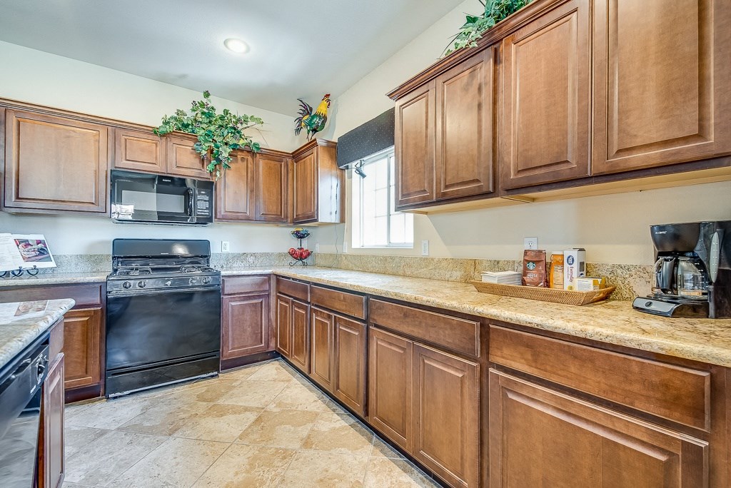 a kitchen with wooden cabinets and a counter top