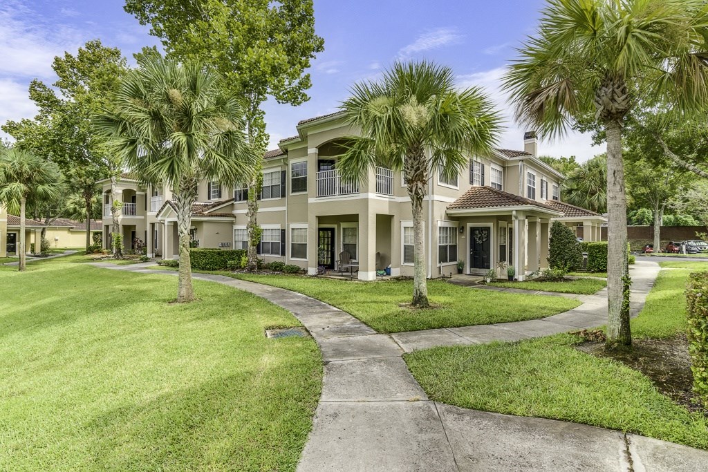 A row of houses with a walkway between them.