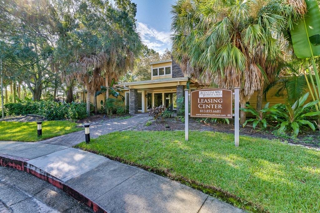 leasing center sign in front of office