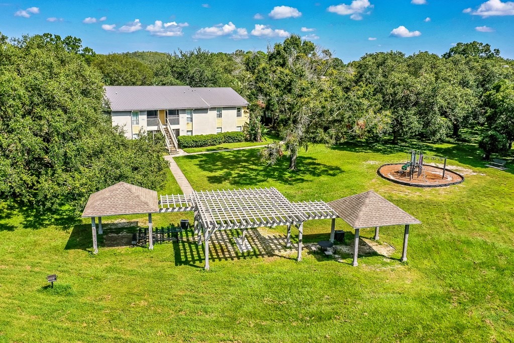 a birds eye view of a house and a playground