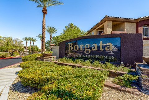 a sign forboraza development homes in front of a building