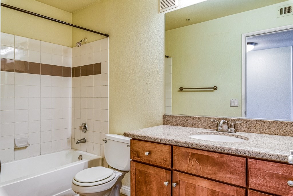 a bathroom with a sink toilet and a tub
