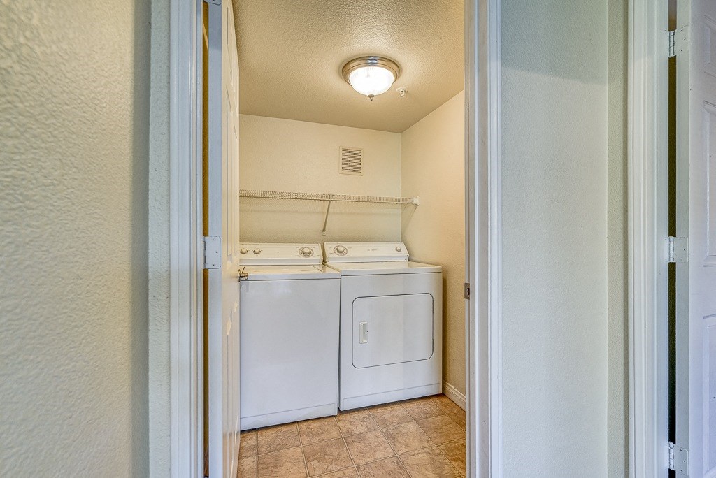 the washer and dryer in the laundry room of a home
