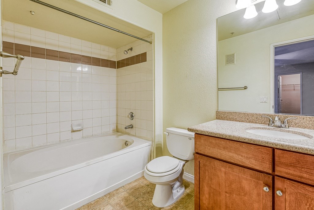 the preserve at ballantyne commons apartment bathroom with tub sink and toilet