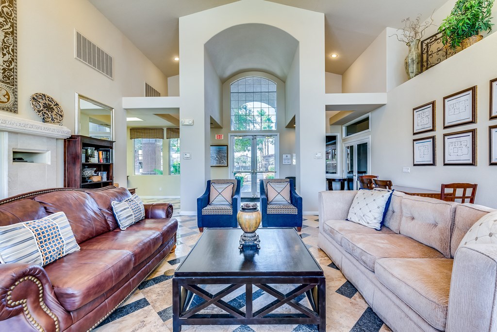 a living room with couches and a coffee table