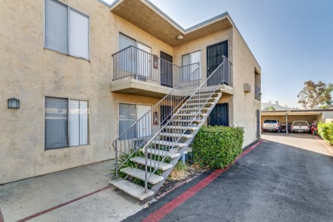 A building with a staircase leading to the second floor.