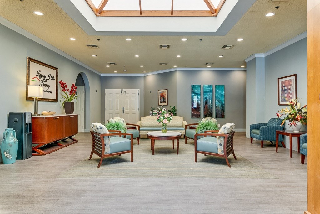 A living room with a white door and a wooden table.