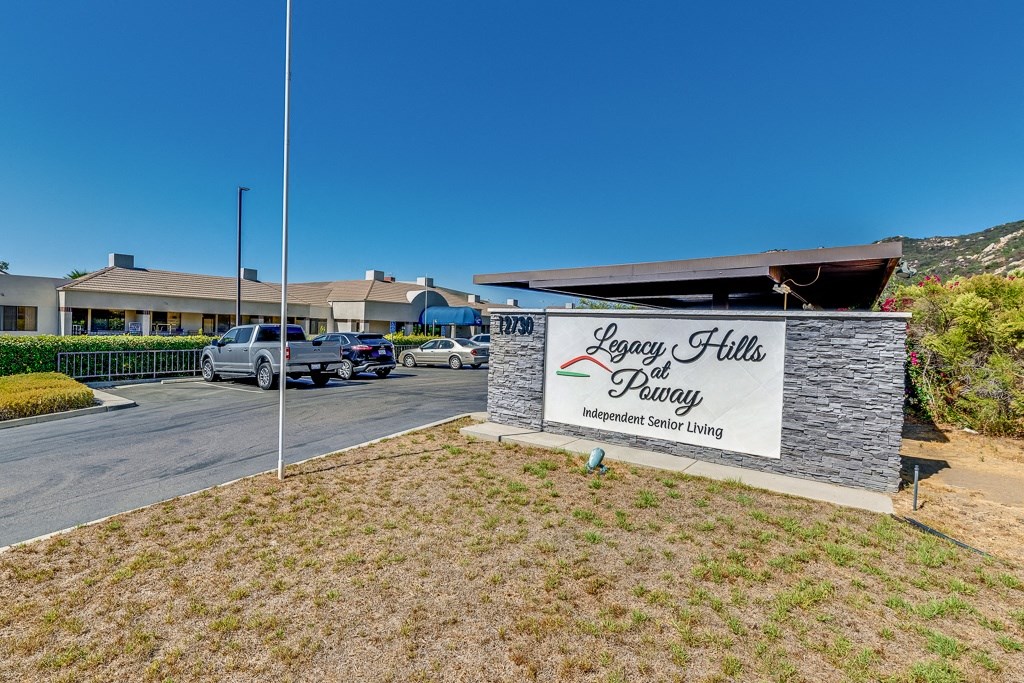 The image shows the front of a senior living facility named Legacy Hills.