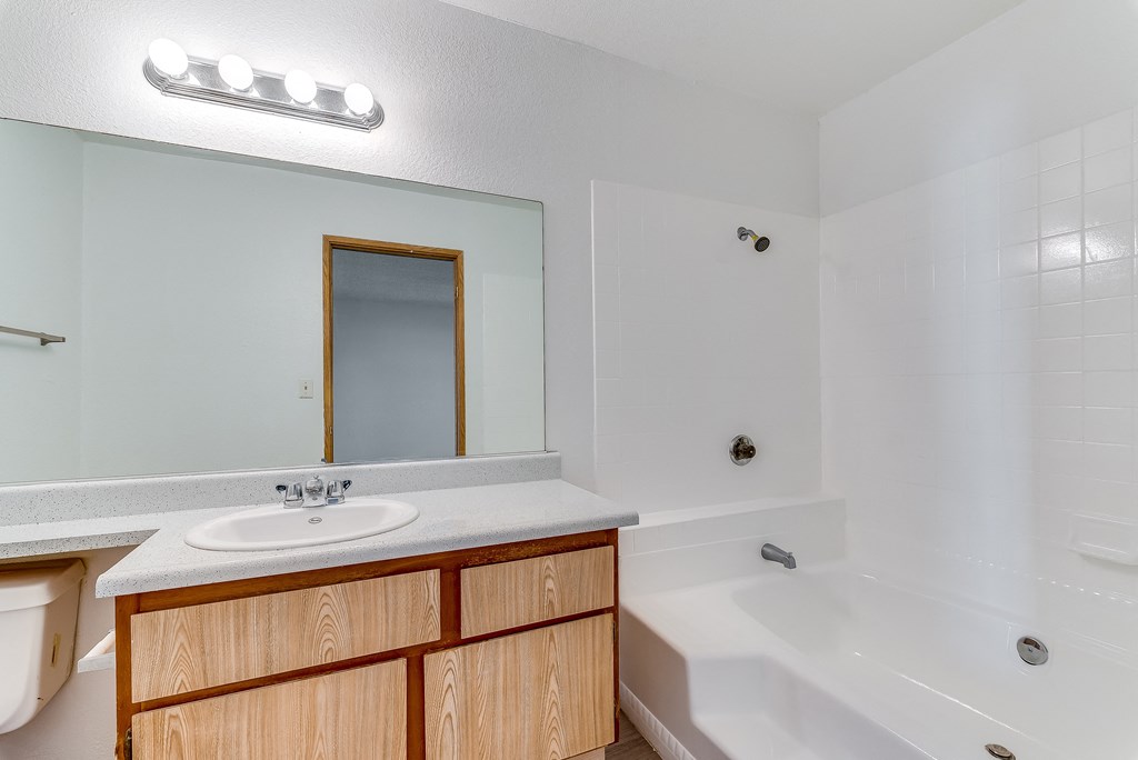 a bathroom with a sink toilet and bathtub at Pacific Harbors Sunrise Apartments, Las Vegas, NV, 89142