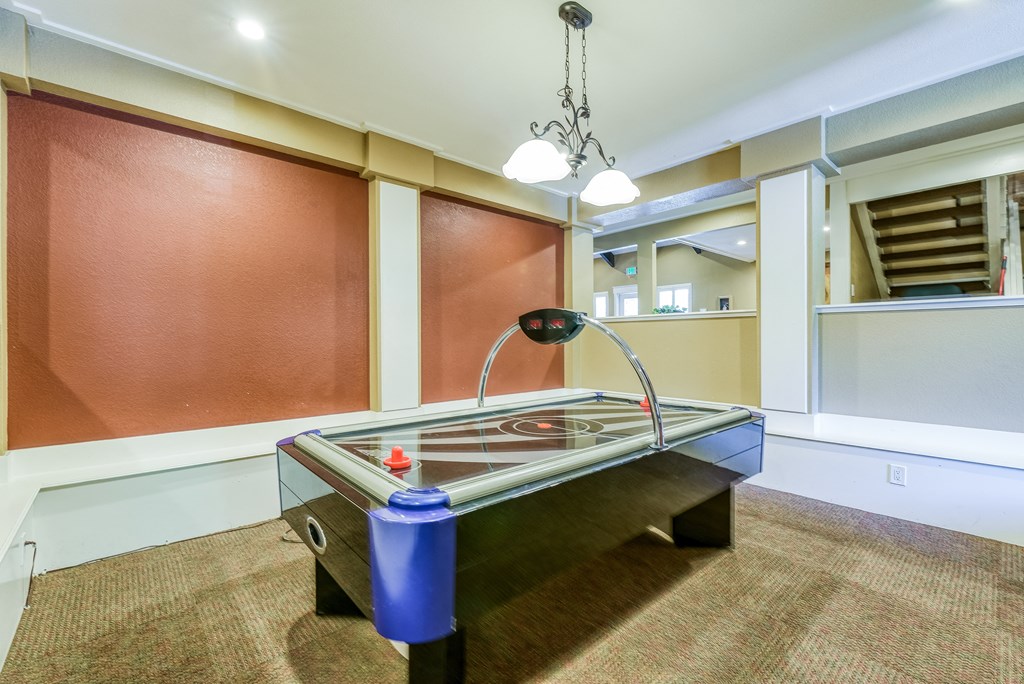 a game room with a foosball table